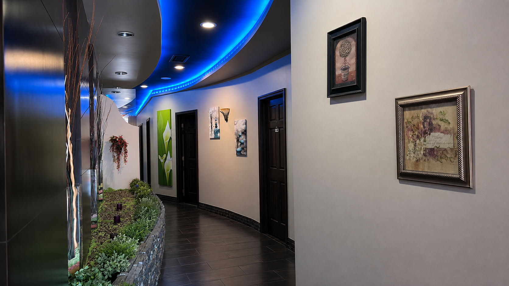 Soo Relax Massage hallway with blue ceiling lights and room doors